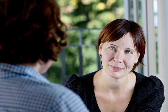 Closeup of woman talking to a counselor