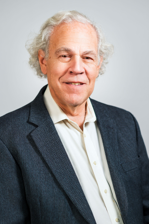 Headshot of a man with white hair