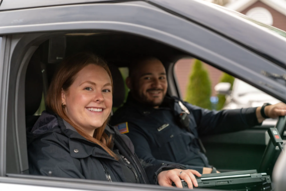 Photo of clinician and officer in cruiser